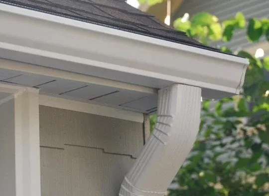 White seamless gutter and downspout